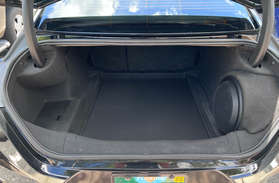 A subwoofer integrated so cleanly into a trunk panel that it looks factory-built